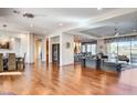 Open-concept living space showcasing hardwood floors, recessed lighting, and seamless flow at 10386 Luna Magico Ave, Las Vegas, NV 89135