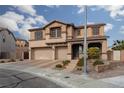Charming two-story home featuring a three-car garage, landscaped front yard, and inviting front porch at 23 Crescent Palm Ct, Henderson, NV 89002