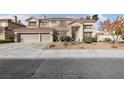 Charming two-story home with a well-maintained yard, three-car garage, and inviting front entrance at 2637 Ohio Ct, Las Vegas, NV 89128