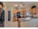 Functional kitchen with stainless steel appliances, granite countertops, and ample cabinet space at 2724 Rosarito St, Las Vegas, NV 89108