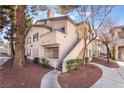 Attractive condo showcasing stairs to private balcony and appealing landscaping at 3062 Tarpon Dr # 201, Las Vegas, NV 89120