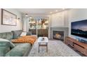 Comfortable living room with fireplace, couch, and sliding doors to balcony at 3062 Tarpon Dr # 201, Las Vegas, NV 89120