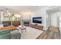 Inviting living room with sliding doors to balcony and a cozy fireplace at 3062 Tarpon Dr # 201, Las Vegas, NV 89120