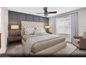 Inviting bedroom with paneled accent wall, neutral colors, and a plush bed for relaxation at 5181 Capucina St # Lot 6, Las Vegas, NV 89122