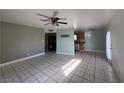 Spacious living room features tiled flooring, ceiling fan, and an open layout perfect for entertaining at 5194 Saratoga Dr, Las Vegas, NV 89120