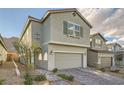 Stylish two-story home with desert landscaping, paver driveway, and attached two-car garage at 5399 El Nevero St, Las Vegas, NV 89166