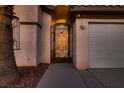 Close-up of the decorative wrought iron gate leading to the front door, adding a touch of elegance to the entrance at 5416 Irish Spring St, Las Vegas, NV 89149