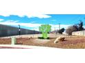 Vacant lot with public art installation of a tree with an attached bench at 5617 Tanya Ave, Las Vegas, NV 89107