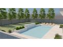 Inviting backyard pool surrounded by lush green lawn, trees, manicured landscaping, and stylish lounge chairs at 6925 Unicorn St, Las Vegas, NV 89131