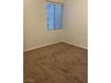 Bedroom with neutral carpet and blind-covered window, ready for personalization at 75 N Valle Verde Dr # 621, Henderson, NV 89074