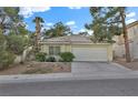 Charming one-story home with desert landscaping and an attached two-car garage with a paved driveway at 7713 Shore Haven Dr, Las Vegas, NV 89128