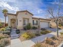 Charming single-story home with a two-car garage and low maintenance landscaping at 9211 Wittig Ave, Las Vegas, NV 89149