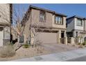 Attractive two-story home with a well-maintained front yard, a two car garage and charming curb appeal at 12553 Skylight View St, Las Vegas, NV 89138