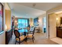 Tastefully furnished living room with a dining table, comfortable seating, and abundant natural light at 145 E Harmon Ave # 1202, Las Vegas, NV 89109