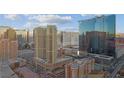 High-rise building exterior showcasing architectural details and surrounding buildings and neighborhood in the distance at 145 E Harmon Ave # 2603, Las Vegas, NV 89109