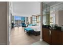 Bright suite featuring stylish furniture, a modern kitchenette, and a panoramic city view through large windows at 145 E Harmon Ave # 2603, Las Vegas, NV 89109