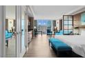 Inviting living room featuring modern furnishings, stylish decor, and city views from a large window at 145 E Harmon Ave # 2603, Las Vegas, NV 89109