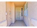 Covered front porch with security door and window at 211 Crown Imperial St, Henderson, NV 89074
