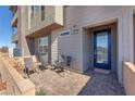 Charming covered front porch with seating area and modern exterior design at 2503 Cracked Stone St, Henderson, NV 89044