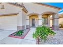 Inviting front entrance with arched accents and a decorative security screen door at 473 Elm Crest Pl, Henderson, NV 89012