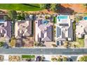 Aerial view of backyard with pool, neighboring houses, and street at 5505 Indian Hills Ave, Las Vegas, NV 89130