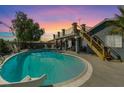 Inviting backyard pool with slide and ample seating, perfect for outdoor relaxation and entertainment at 604 Pioneer St, Las Vegas, NV 89107