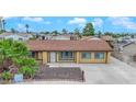 Inviting single-story home featuring a gravel front yard and a lengthy driveway at 7274 Pinebrook Cir, Las Vegas, NV 89147