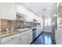 Modern kitchen with stainless steel appliances, ample cabinet space, and stylish countertops, perfect for cooking and entertaining at 730 S Royal Crest Cir # 424, Las Vegas, NV 89169