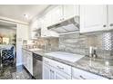 Well-appointed kitchen featuring sleek stainless steel appliances, granite countertops, and ample cabinet space at 730 S Royal Crest Cir # 424, Las Vegas, NV 89169