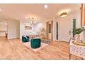 Elegant living room boasts wood floors, high ceilings, stylish furnishings, and ample natural light at 7565 N Torrey Pines Dr # A, Las Vegas, NV 89131