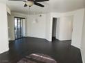 Bright living room with dark wood floors and sliding glass door at 8455 W Sahara Ave # 226, Las Vegas, NV 89117