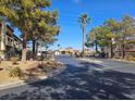 Neighborhood street view with trees lining the road at 8455 W Sahara Ave # 226, Las Vegas, NV 89117