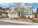 Striking two-story house with a modern design, two-car garage, and desert-friendly yard at 9690 Hiking Ave, Las Vegas, NV 89166
