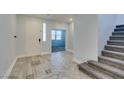 Bright entryway with beautiful tile, a staircase, and an inviting, open atmosphere at 981 Soaring Moon Dr, Henderson, NV 89015
