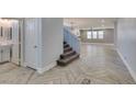Inviting entryway features stylish tile flooring, stairs and plenty of natural light at 981 Soaring Moon Dr, Henderson, NV 89015