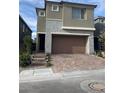 Charming two-story home features a well-manicured front yard, a two-car garage, and a welcoming entrance at 12451 Island Bells Ave, Las Vegas, NV 89138