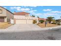 A single-Gathering home exhibits a two-car garage, a low-maintenance yard, and a traditional Southwest design at 1804 Michael Ct, Henderson, NV 89014
