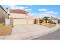 The house has a two-car garage, a low-maintenance yard, and a timeless Southwest architectural style at 1804 Michael Ct, Henderson, NV 89014
