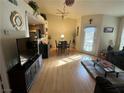 Bright living room featuring modern wood floors and abundant natural light at 1830 N Pecos Rd # 230, Las Vegas, NV 89115