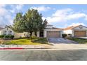 Attractive single-story home with mature tree providing shade to the home's facade at 1835 Swallow Hill Ave, Henderson, NV 89012