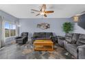 A cozy living room with plush furniture, a wooden coffee table, and stylish flooring at 262 Big Horn Dr, Boulder City, NV 89005