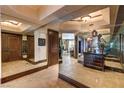 Hallway featuring mirrored walls and an elegant entryway with paneled wood doors at 2747 Paradise Rd # 801, Las Vegas, NV 89109