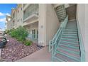 Exterior stairs lead to upper units, with well-maintained landscaping and desert rock ground cover at 3550 Bay Sands Dr # 2087, Laughlin, NV 89029