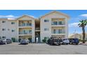 Multi-story condo building features balconies, parking, and well-maintained landscaping at 3550 Bay Sands Dr # 2087, Laughlin, NV 89029