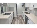 Spacious kitchen featuring stainless steel appliances, quartz countertops, and a sleek design at 5494 Waltham Ln, Las Vegas, NV 89122