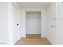 The entry of the condo has wood floors, closet and neutral paint at 600 Willow Green Dr, Las Vegas, NV 89169
