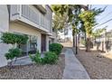 This condo features easy access with a well-maintained walkway and landscaping at 600 Willow Green Dr, Las Vegas, NV 89169