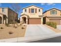 Charming two-story home featuring a two-car garage and low-maintenance xeriscape front yard at 7722 Sagamore Bay Ct, Las Vegas, NV 89179