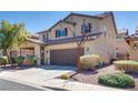 Two-story home with a well-maintained front yard and a convenient two-car garage at 933 Monte Nerone Ave, Henderson, NV 89012