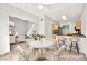 Cozy living room with dining area and kitchen in the background at 1637 Aspen Meadows Dr, Henderson, NV 89014